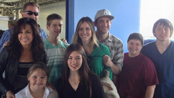 Brandon with his siblings and mother.
